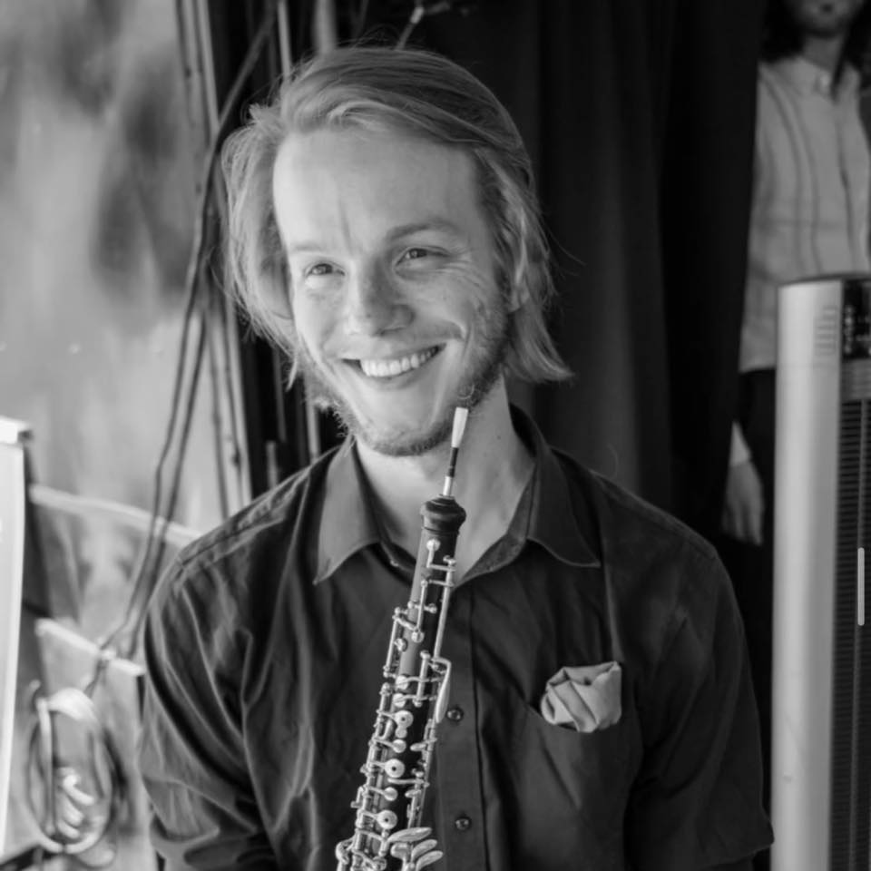 Alex Fricker holding an oboe
